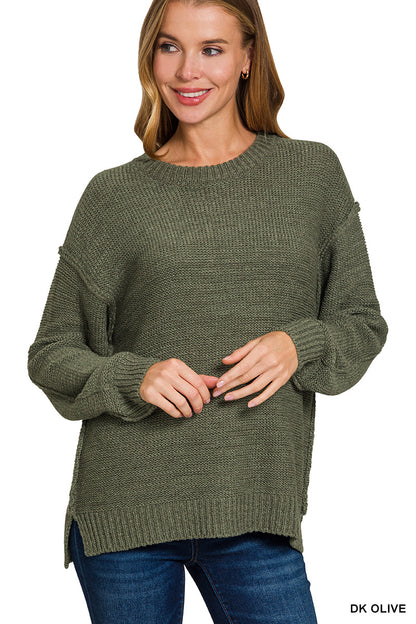 Exposed seam round neck sweater