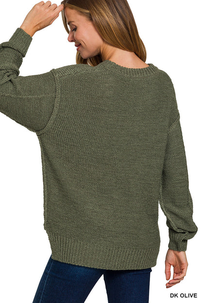 Exposed seam round neck sweater